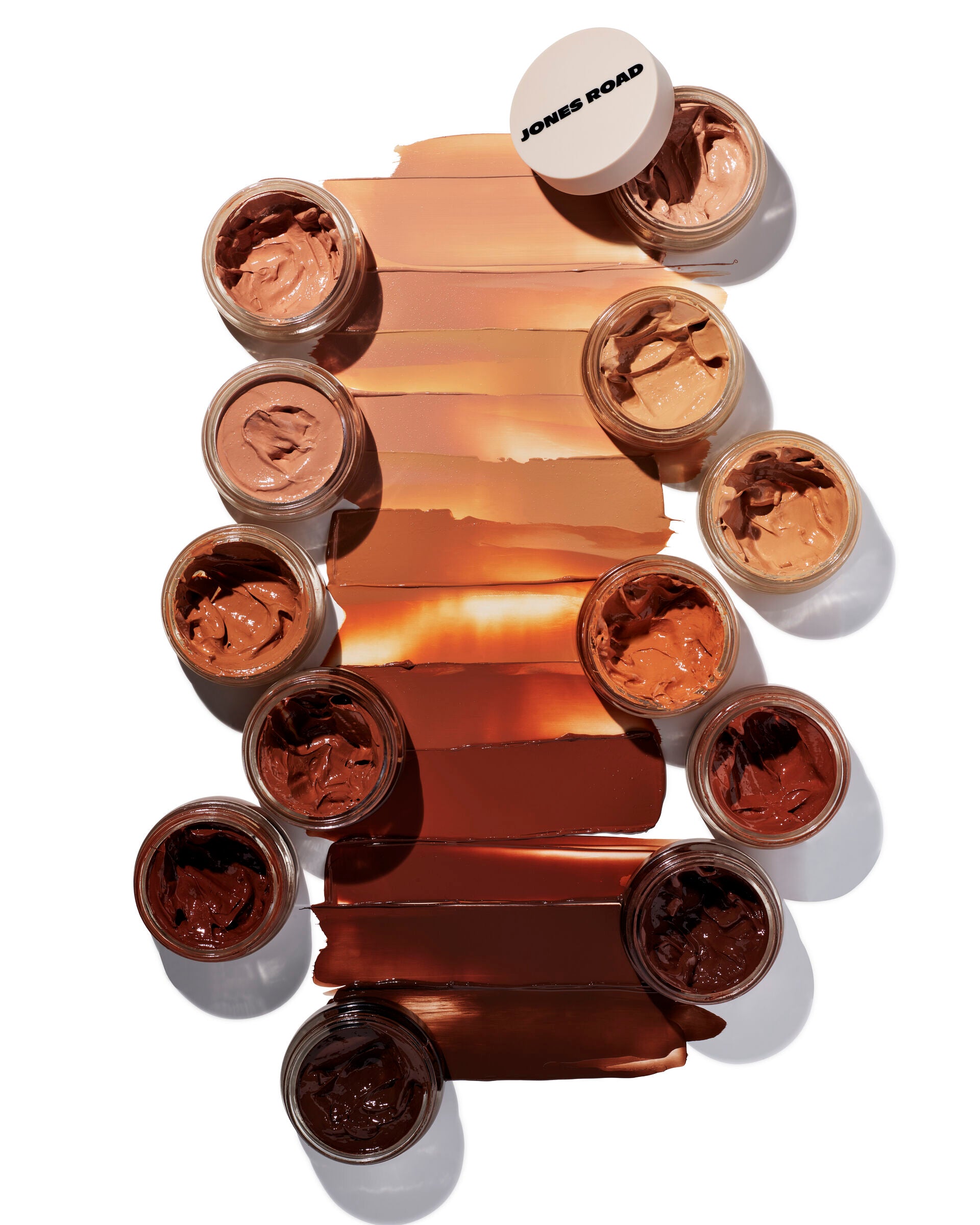 Several swatches of What The Foundation from Jones Road Beauty showing the different shades available.