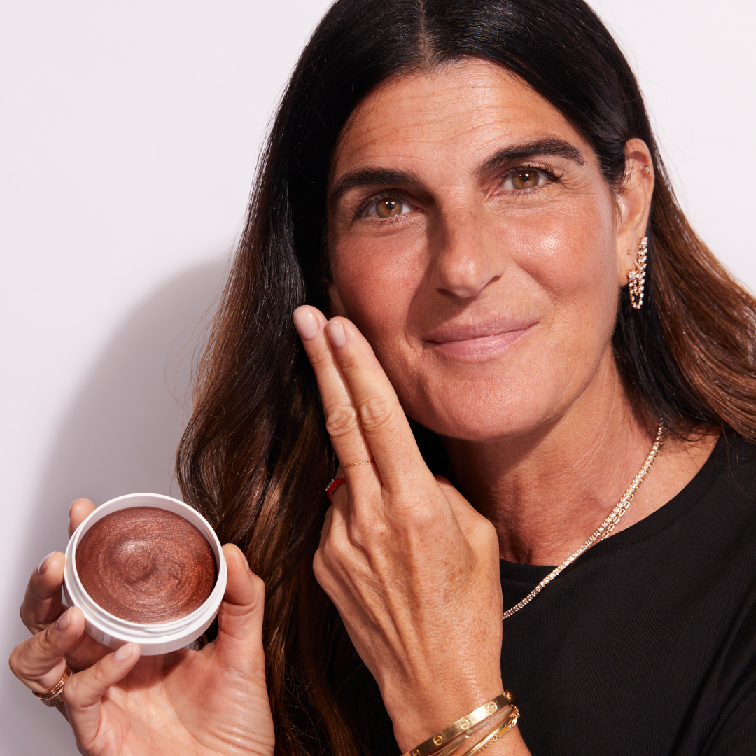 A woman applying Jones Road Beauty's Miracle Balm